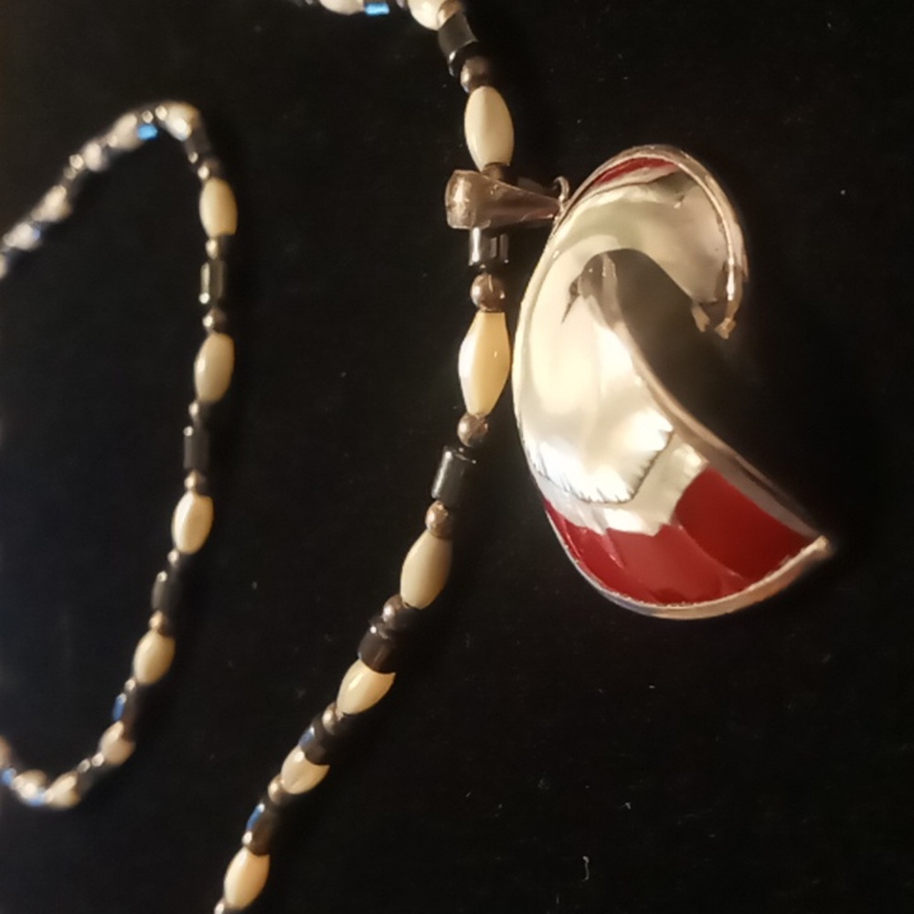 shell wrapped in silver pendant on a strung hermitite & mother of pearl